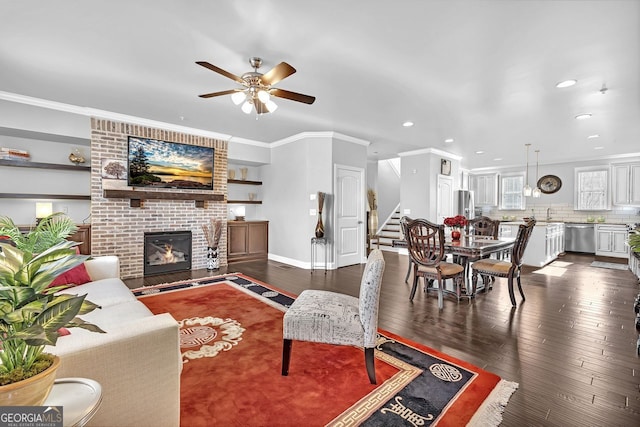 living room featuring crown molding, stairway, and dark wood-type flooring