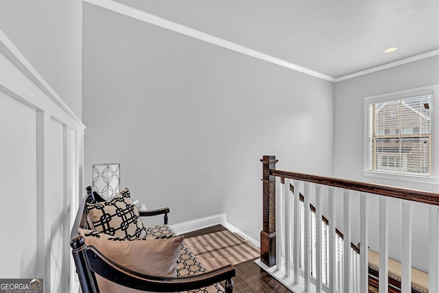 hallway featuring baseboards, dark wood-type flooring, crown molding, an upstairs landing, and recessed lighting