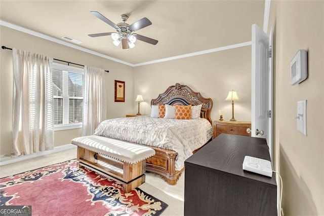 bedroom featuring carpet floors, visible vents, ornamental molding, and ceiling fan