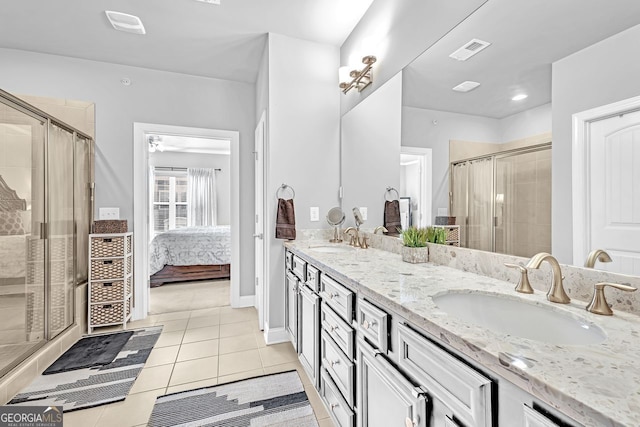 full bath with a stall shower, a sink, visible vents, and tile patterned floors