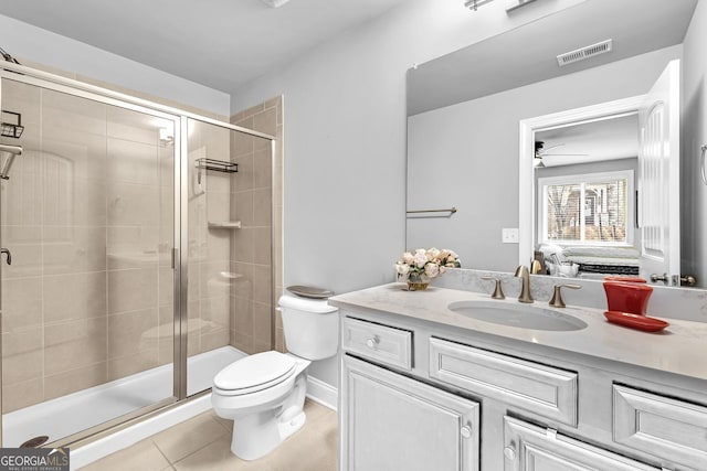 ensuite bathroom featuring visible vents, connected bathroom, toilet, vanity, and a shower stall