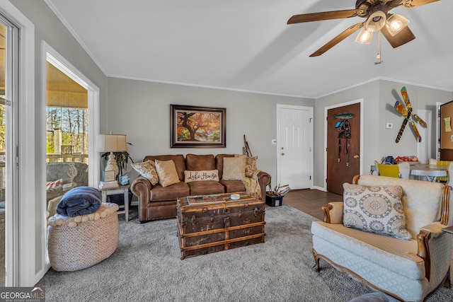 living room featuring ceiling fan and ornamental molding