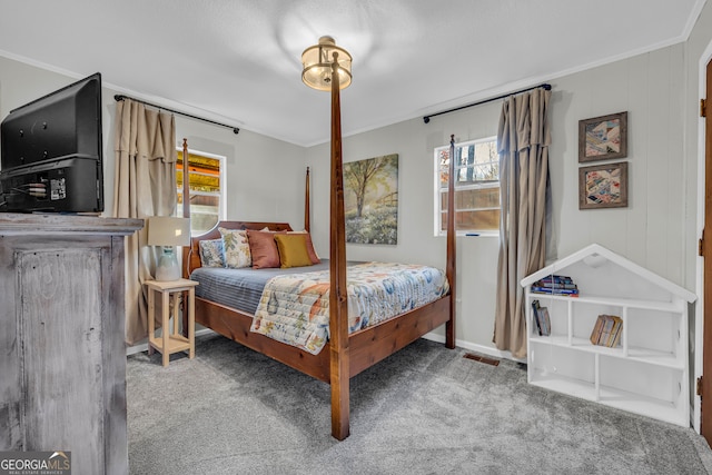 carpeted bedroom featuring ornamental molding