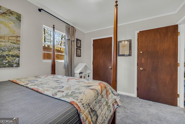 carpeted bedroom with ornamental molding