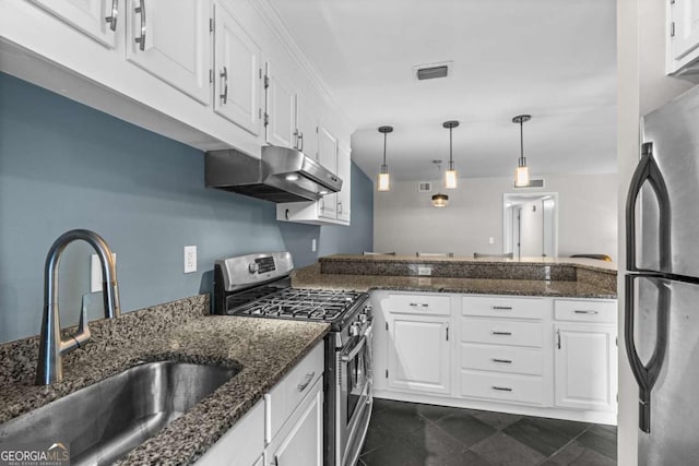 kitchen featuring dark stone countertops, sink, white cabinets, and appliances with stainless steel finishes