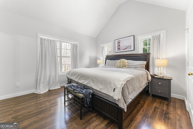 bedroom with high vaulted ceiling and dark wood-type flooring