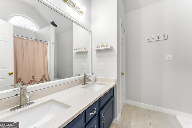 bathroom with vanity and tile patterned floors