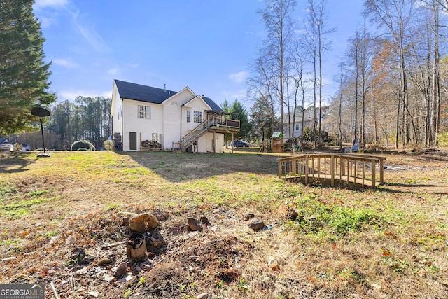 view of yard with a wooden deck