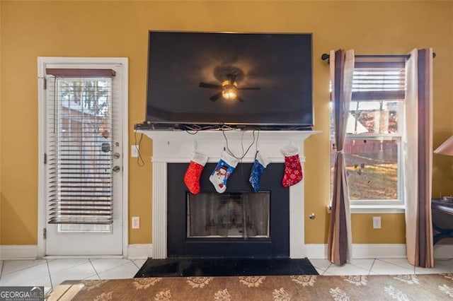 interior space featuring light tile patterned floors and ceiling fan