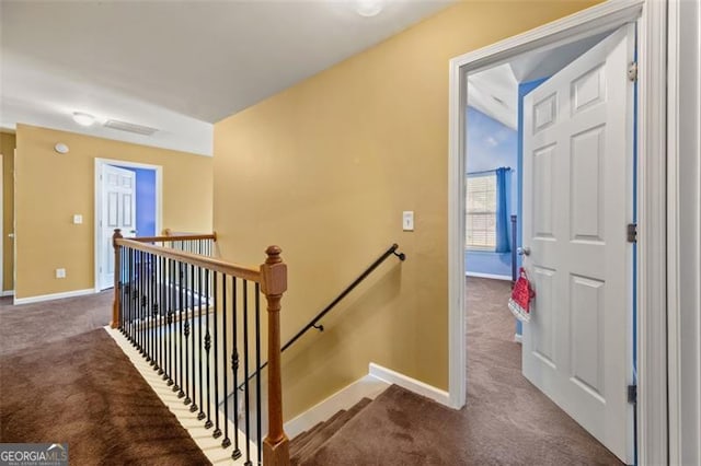 staircase with carpet floors