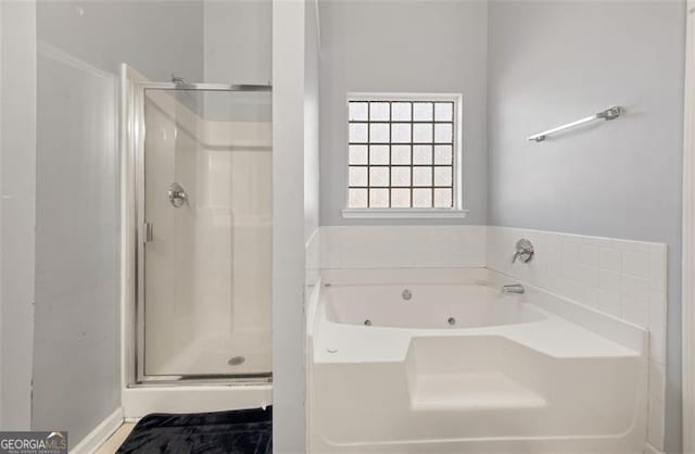 bathroom with separate shower and tub