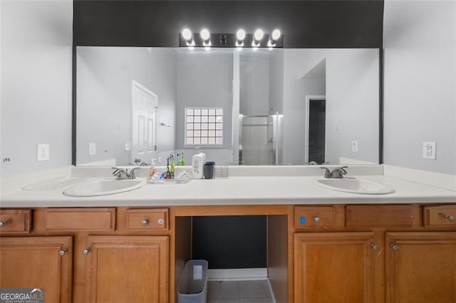 bathroom featuring tile patterned floors, vanity, and an enclosed shower