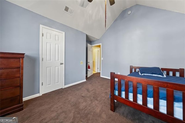 bedroom with ceiling fan, lofted ceiling, and dark colored carpet