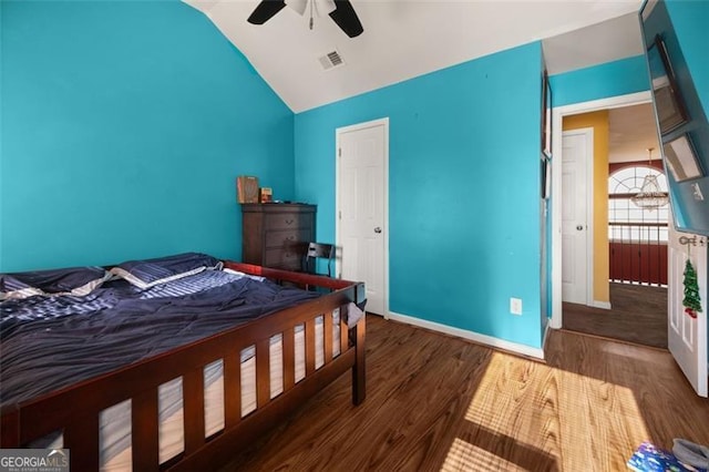 bedroom featuring hardwood / wood-style floors, ceiling fan, and high vaulted ceiling