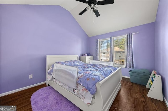 bedroom featuring ceiling fan, dark hardwood / wood-style floors, and lofted ceiling