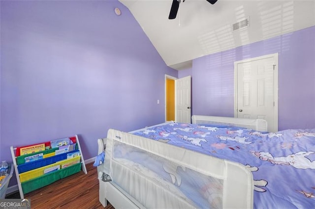 bedroom featuring ceiling fan, lofted ceiling, and dark wood-type flooring