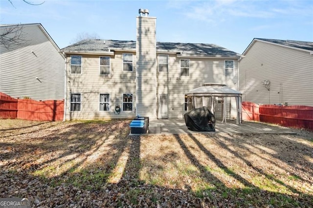 back of house featuring a gazebo and a patio area