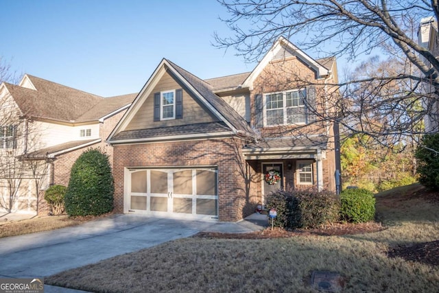 view of front of home with a garage and a front yard