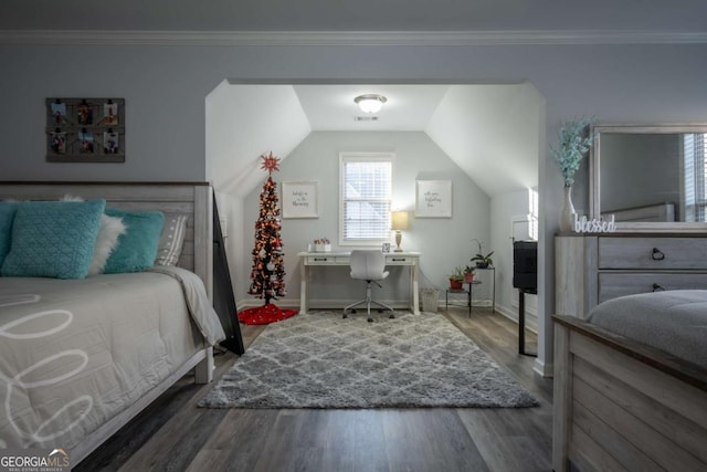 bedroom with ornamental molding, dark wood-type flooring, and vaulted ceiling