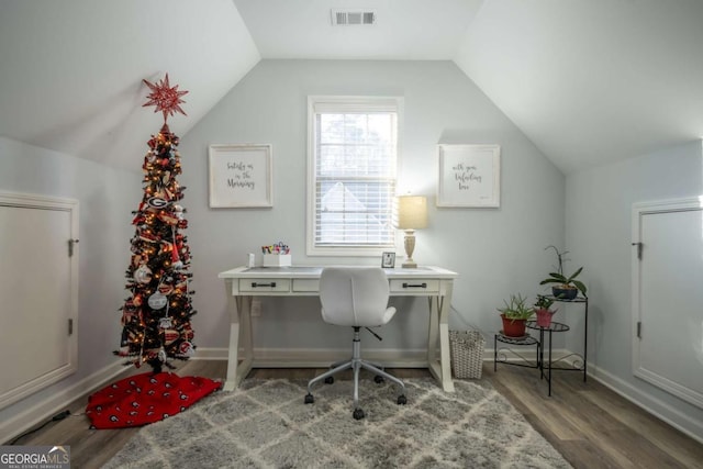 home office featuring wood-type flooring and vaulted ceiling