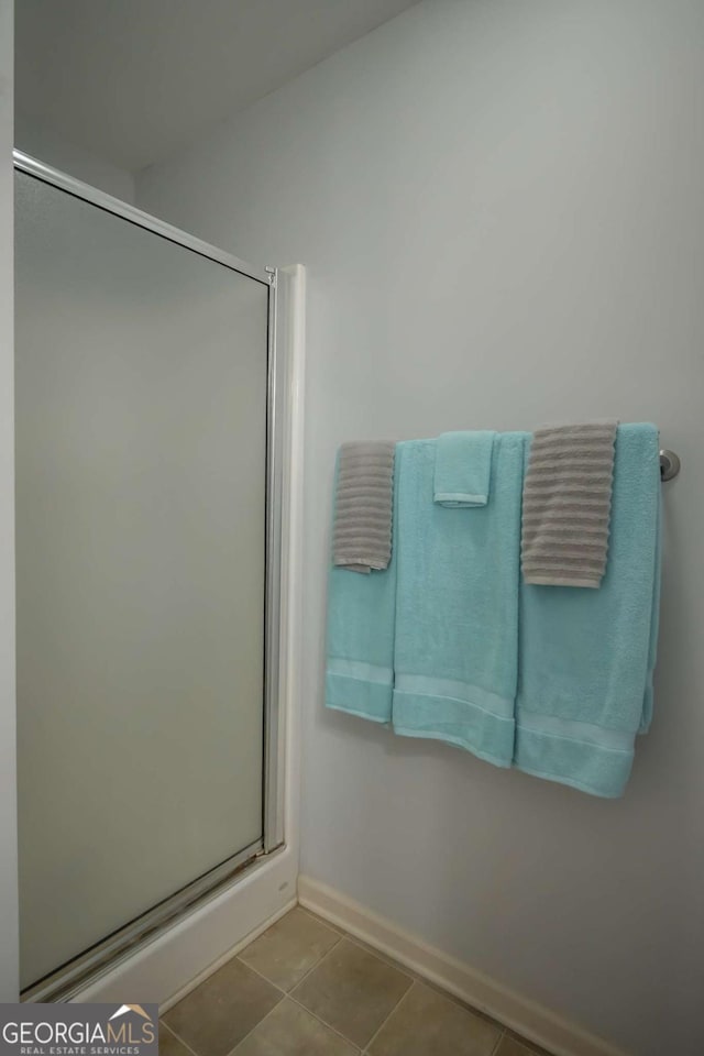 bathroom featuring tile patterned floors and walk in shower