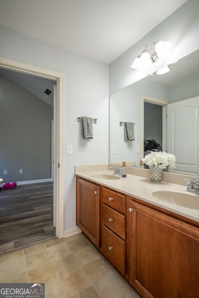 bathroom with vanity and wood-type flooring