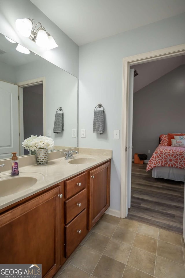 bathroom featuring vanity and hardwood / wood-style flooring