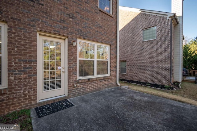 doorway to property with a patio