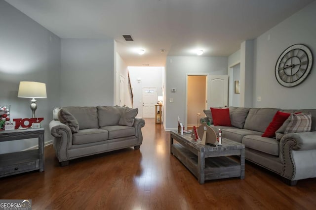 living room featuring dark hardwood / wood-style floors