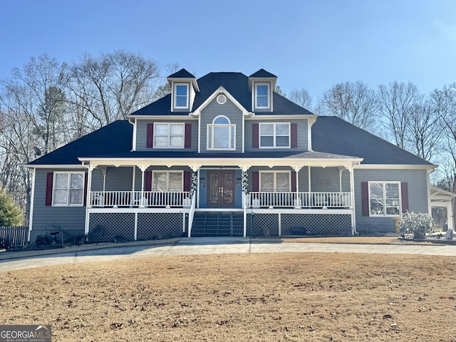 view of front of property with covered porch and a front yard