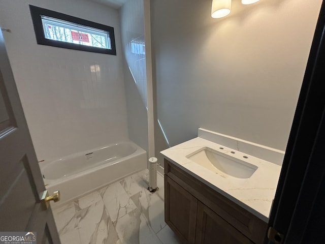 bathroom with marble finish floor, shower / tub combination, and vanity