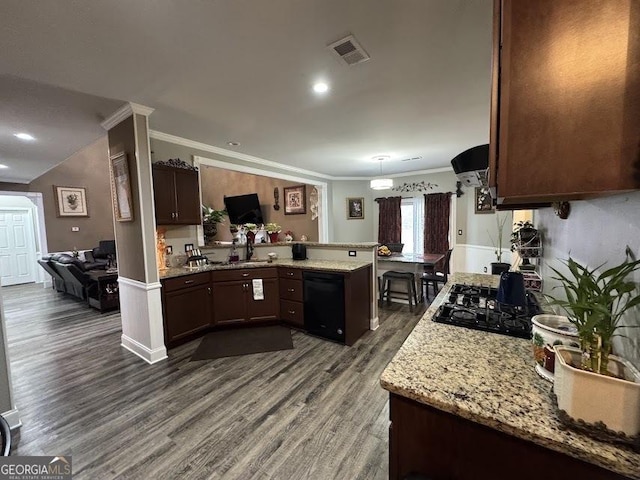 kitchen featuring dark brown cabinetry, dark hardwood / wood-style flooring, kitchen peninsula, black appliances, and ornamental molding