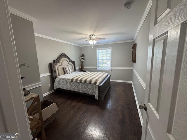 bedroom with ceiling fan, dark hardwood / wood-style flooring, and crown molding