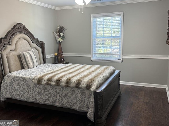 bedroom with crown molding and dark wood-type flooring