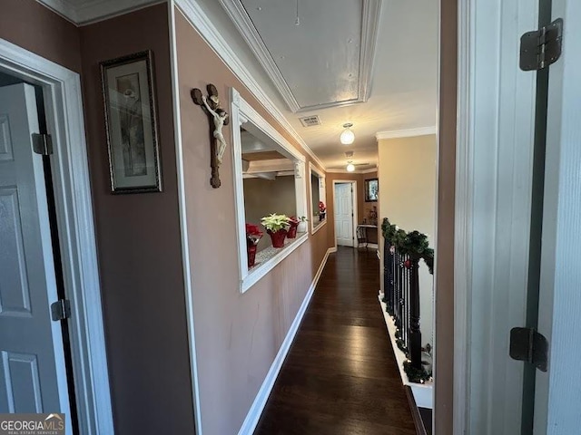 hall with ornamental molding and dark wood-type flooring