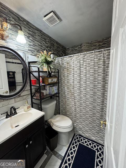 bathroom featuring backsplash, toilet, vanity, tile walls, and a shower with shower curtain