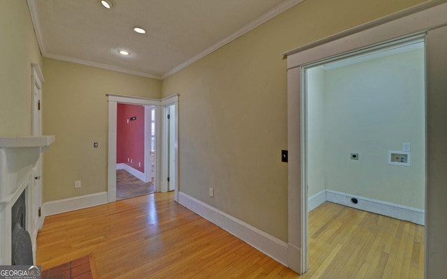 laundry area with hookup for a washing machine, light hardwood / wood-style floors, and electric dryer hookup