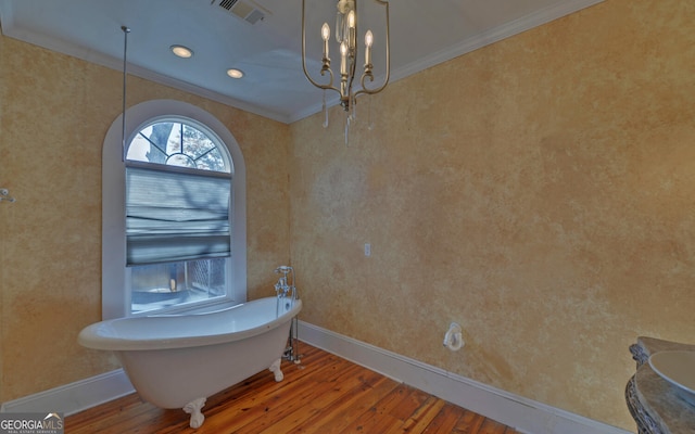 bathroom with a chandelier, wood-type flooring, and crown molding