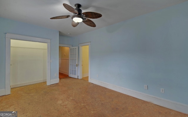 unfurnished bedroom with ceiling fan, a closet, and light colored carpet