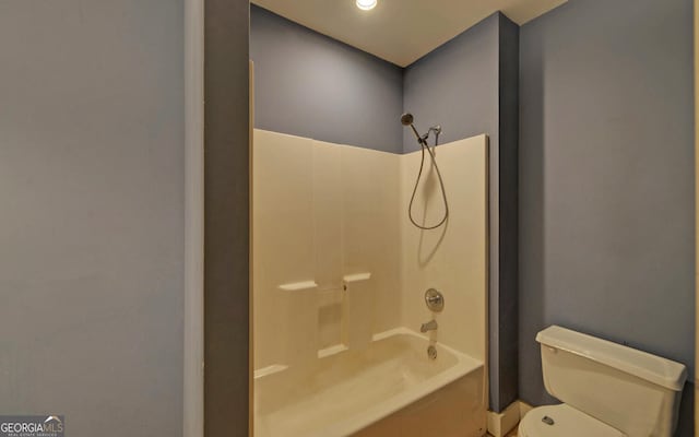 bathroom with shower / tub combination and toilet