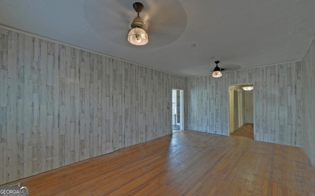 spare room with light hardwood / wood-style flooring and ceiling fan