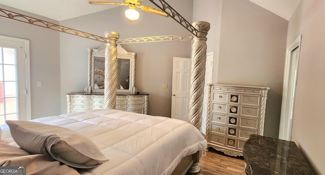 bedroom featuring ceiling fan, vaulted ceiling, and hardwood / wood-style flooring