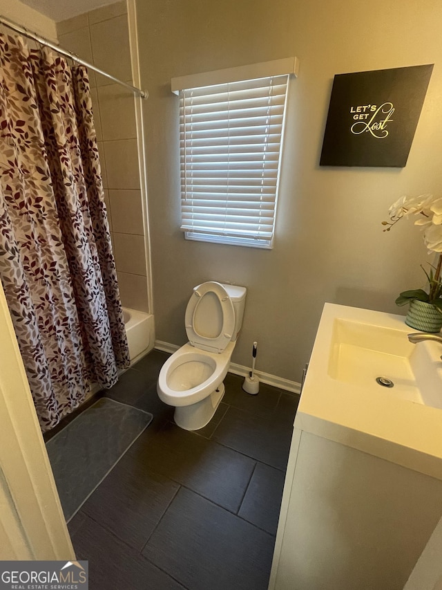 full bathroom with tile patterned floors, vanity, shower / bath combo, and toilet