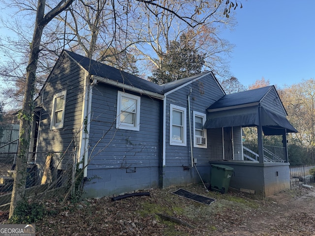 view of side of property featuring cooling unit