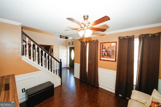 interior space with crown molding, dark hardwood / wood-style flooring, and ceiling fan