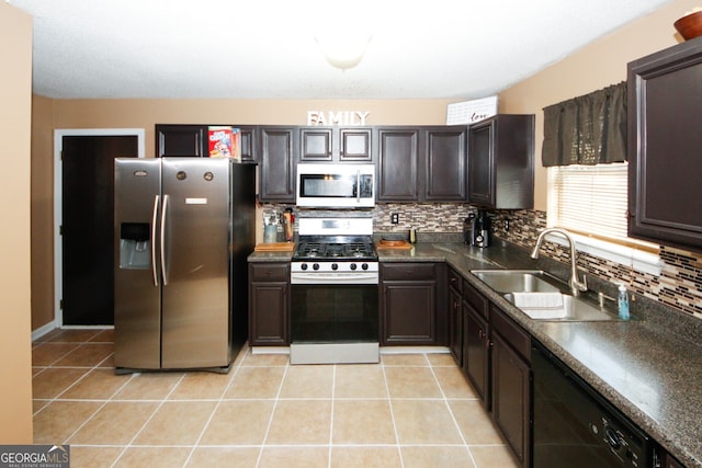 kitchen with dishwasher, sink, light tile patterned flooring, stainless steel fridge with ice dispenser, and range with gas cooktop