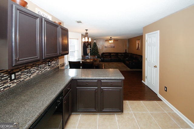 kitchen featuring dishwasher, ceiling fan with notable chandelier, decorative backsplash, light tile patterned floors, and kitchen peninsula