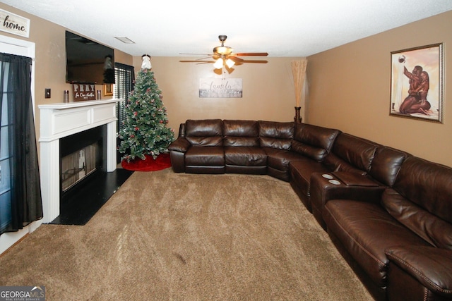 living room featuring carpet flooring and ceiling fan