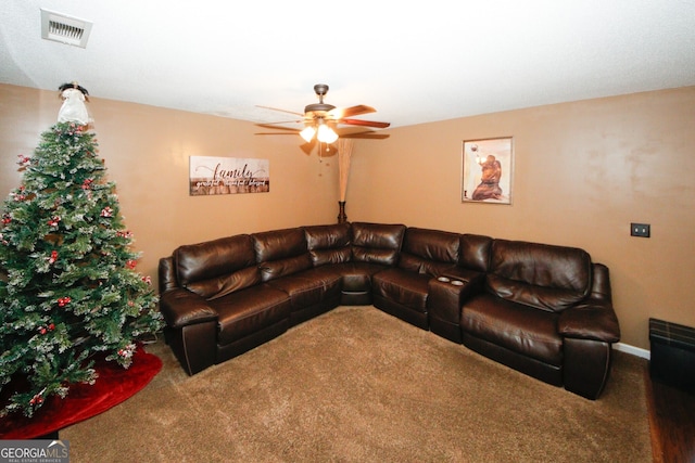 carpeted living room featuring ceiling fan