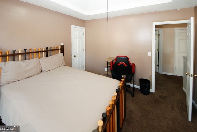 bedroom featuring dark colored carpet